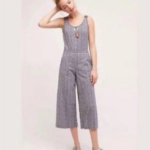 Anthro romper with open back and beautiful details